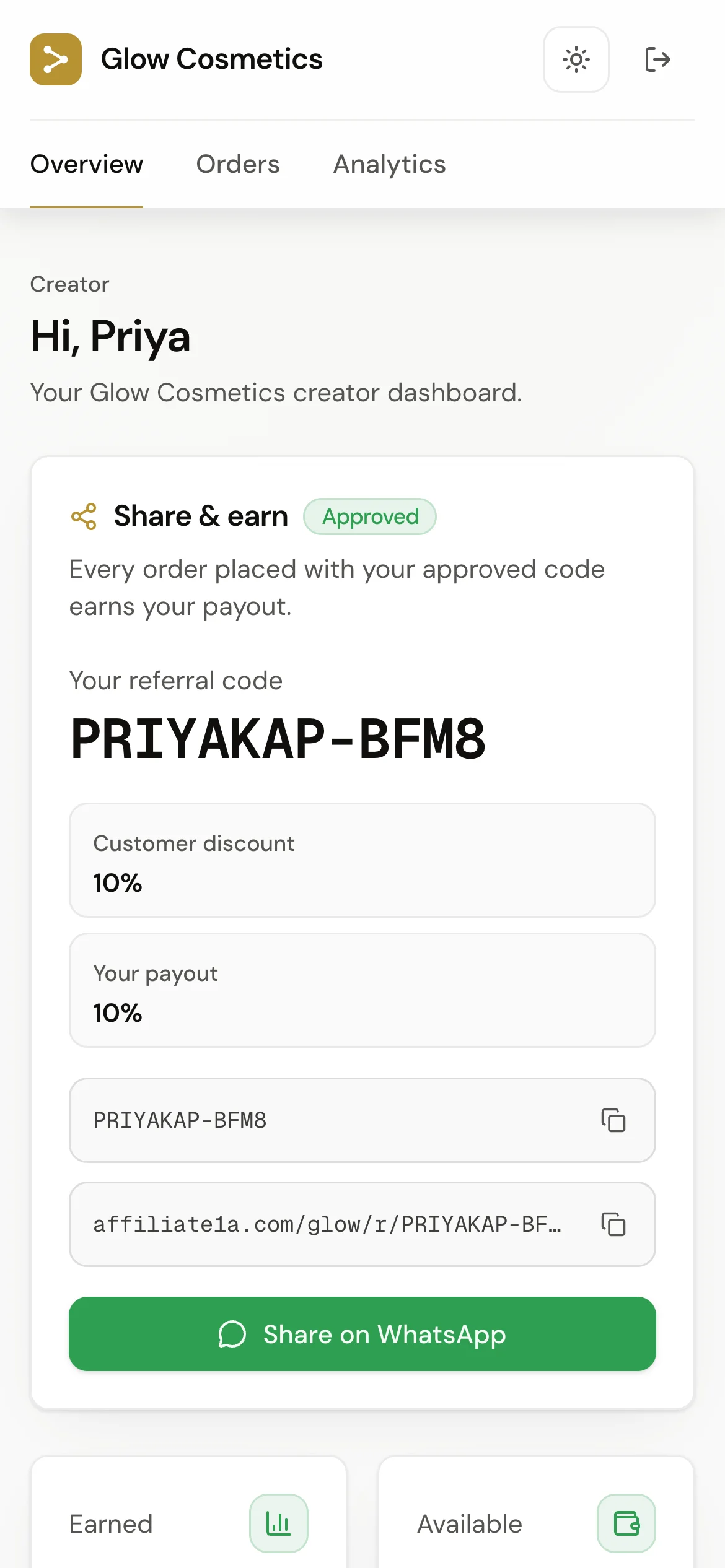 Affiliate1A creator dashboard on a phone: personal referral code, payout terms, and WhatsApp sharing
